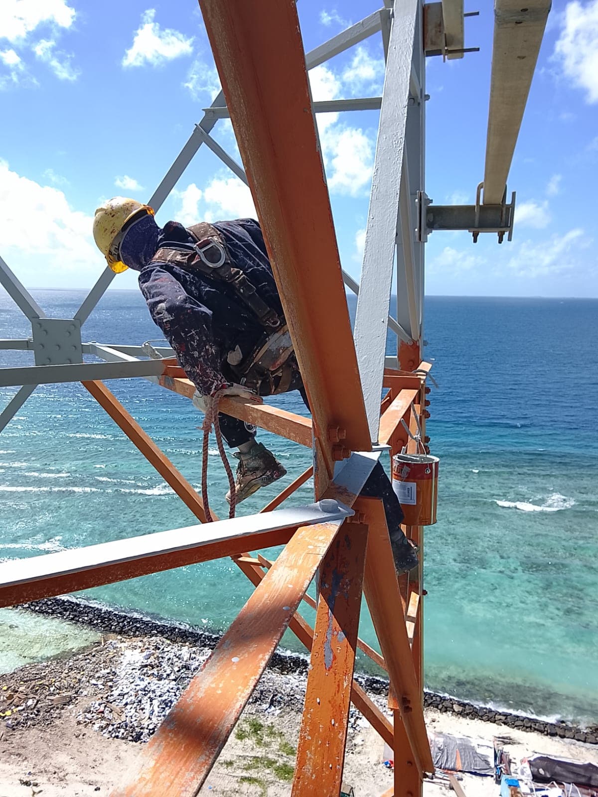 Rishthaa painter recoating tower steel high above the reef
