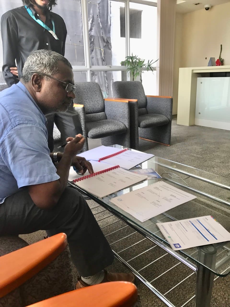 Design and build planning drawings reviewed on a Rishthaa construction site
